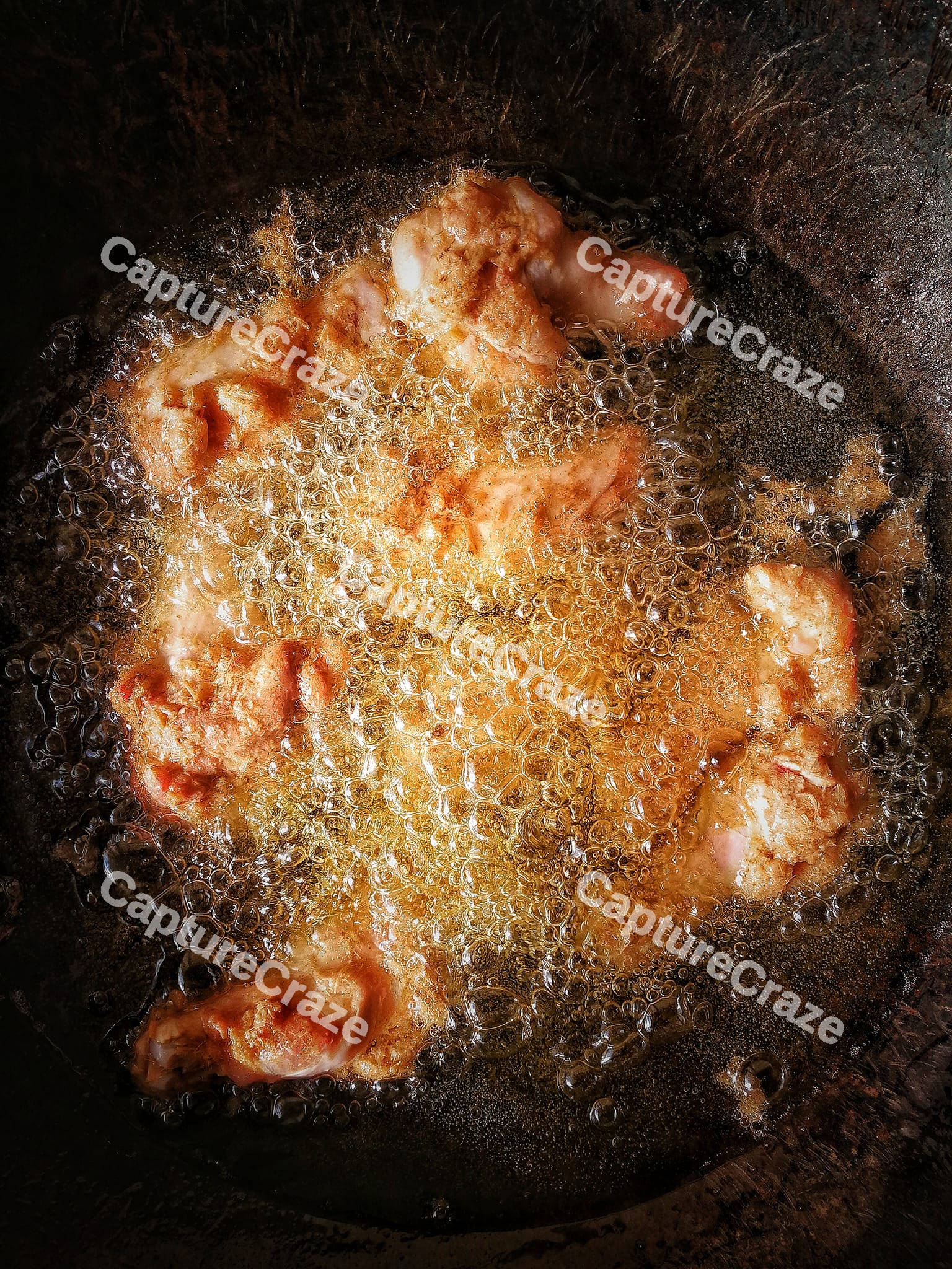 Fried chicken legs in the boiling oil